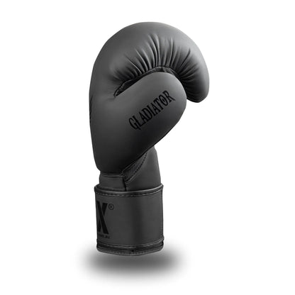Side profile of GSX Black on black boxing glove featuring smooth contour padding and a reinforced wrist strap
