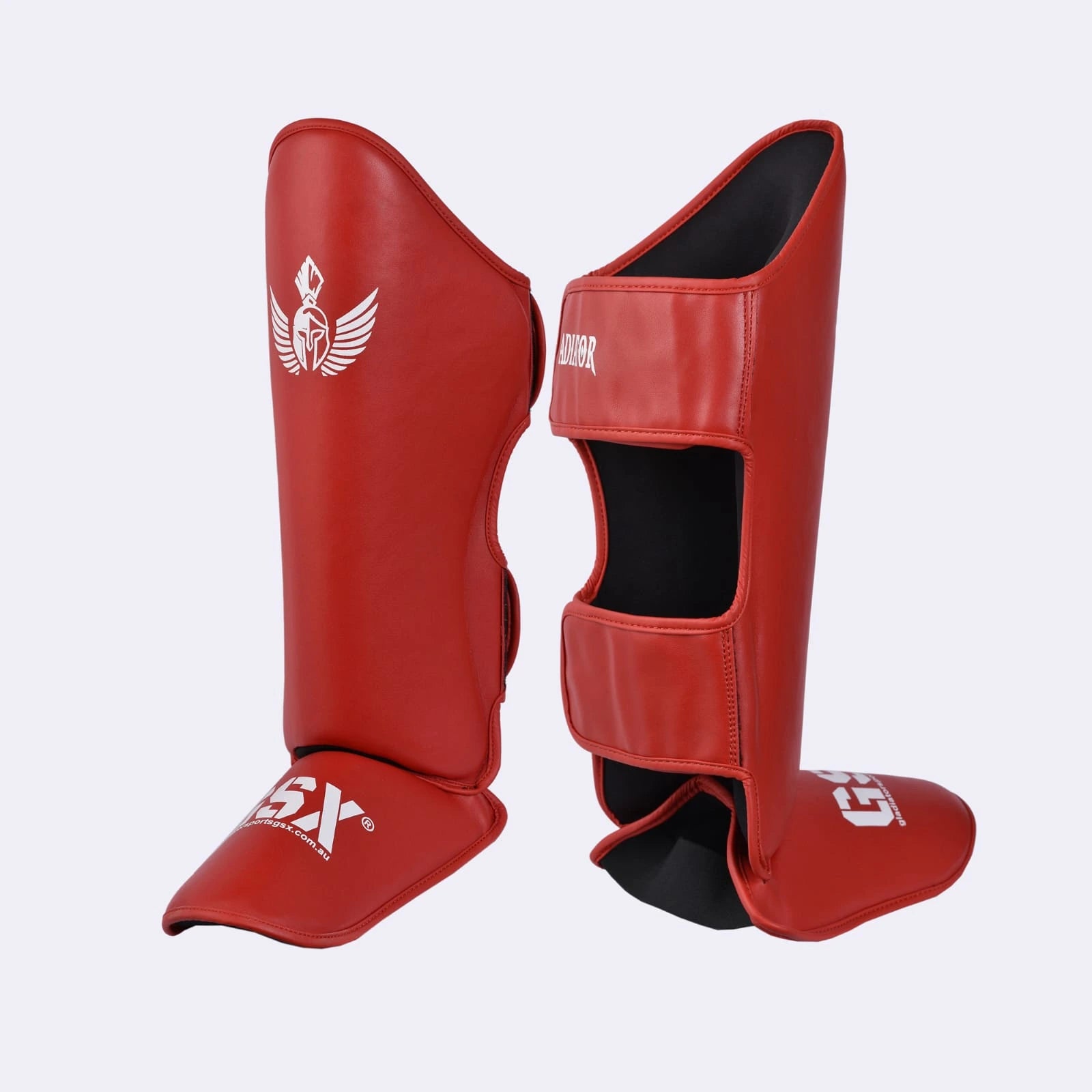Red GSX Gladiator MMA shin guards angled view, showing front instep and rear closure straps.