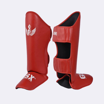 Red GSX Gladiator MMA shin guards angled view, showing front instep and rear closure straps.