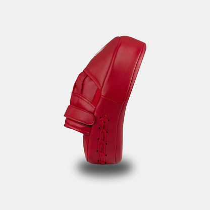 White on Red GSX boxing focus mitt pad with thick padding and wrist support, side view

