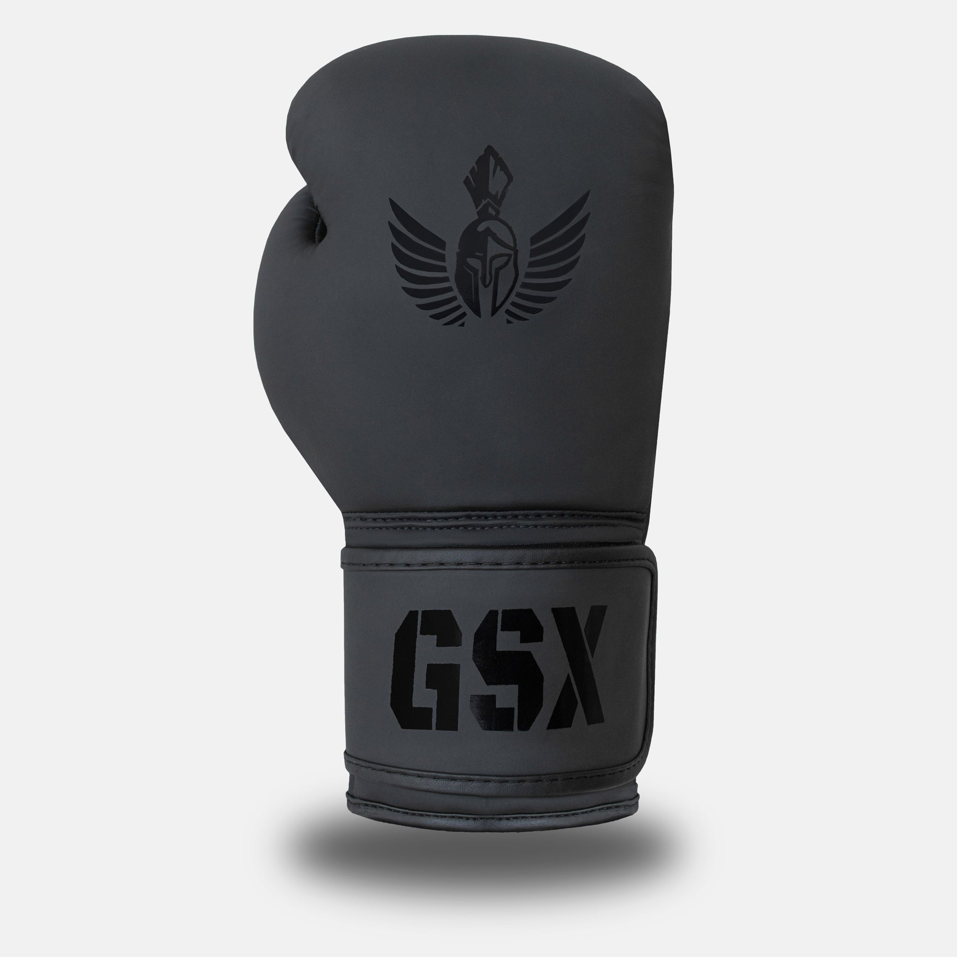 Front view of a GSX black-on-black boxing glove with matte finish and dark logo detailing.

