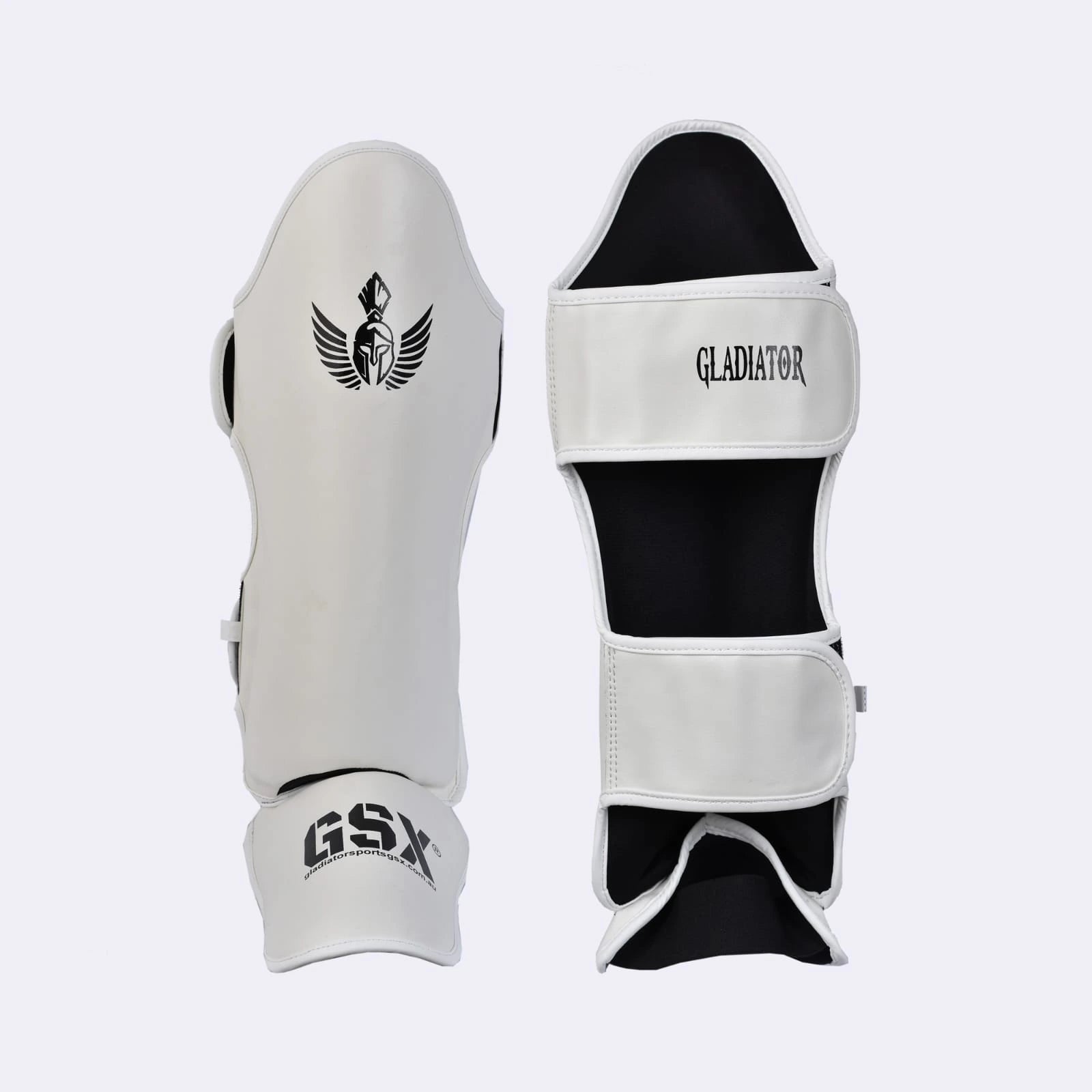 Front and back view of white Gladiator GSX martial arts shin guards with black logos and straps.