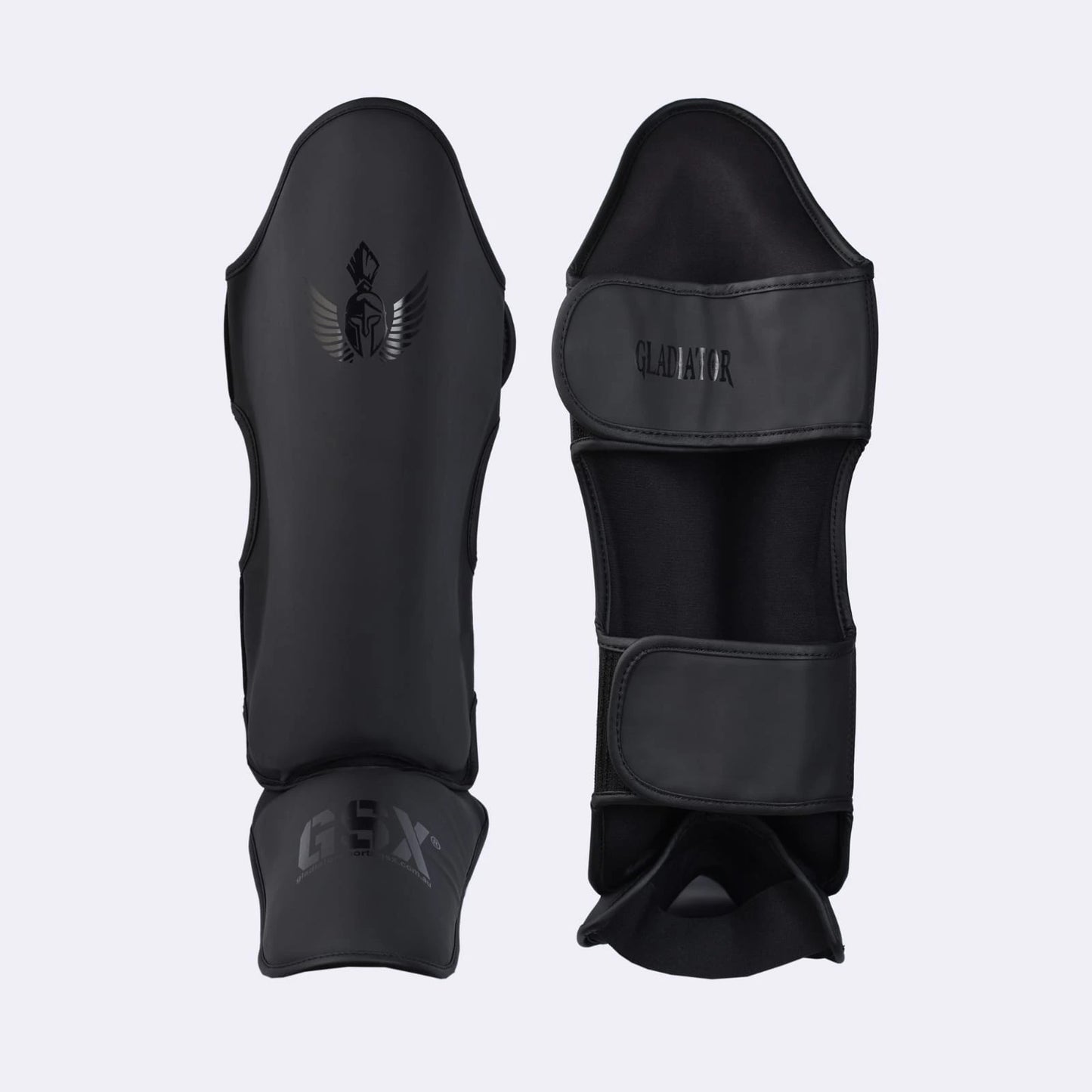 Professional black Gladiator shin guards with GSX branding, designed for combat sports and martial arts training.
