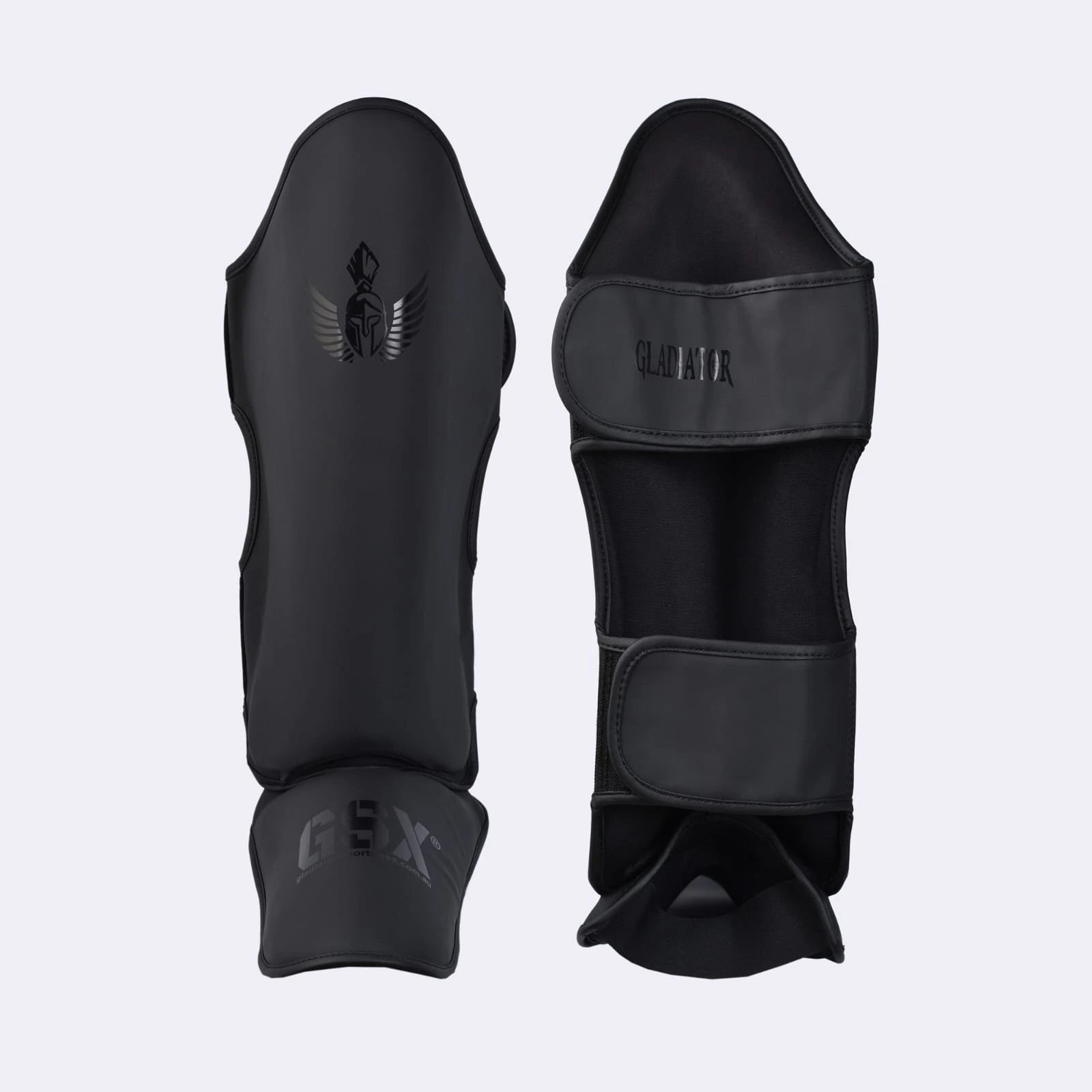 Professional black Gladiator shin guards with GSX branding, designed for combat sports and martial arts training.